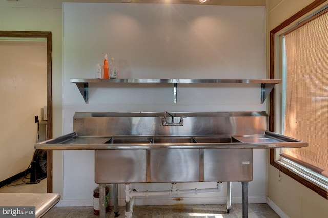 miscellaneous room featuring light tile flooring