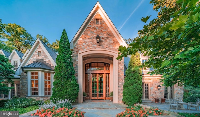 property entrance featuring french doors