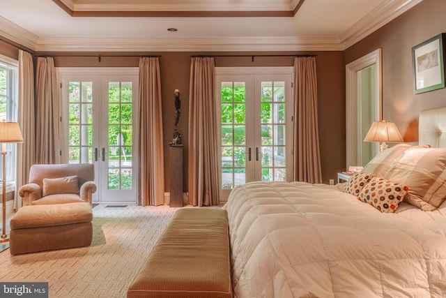 carpeted bedroom featuring ornamental molding, access to outside, and french doors