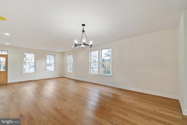 interior space featuring a chandelier and light wood-type flooring