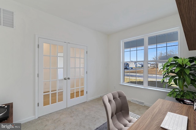 office space featuring french doors and light carpet