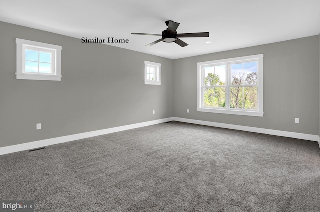 carpeted spare room featuring ceiling fan