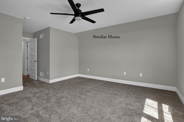 spare room with ceiling fan and dark carpet