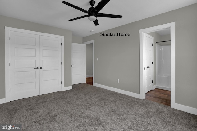 unfurnished bedroom featuring ensuite bathroom, ceiling fan, a closet, and dark colored carpet