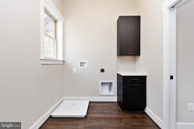 washroom featuring electric dryer hookup, dark hardwood / wood-style floors, and hookup for a washing machine