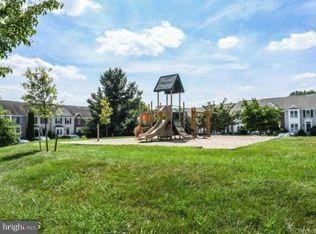 view of jungle gym featuring a lawn