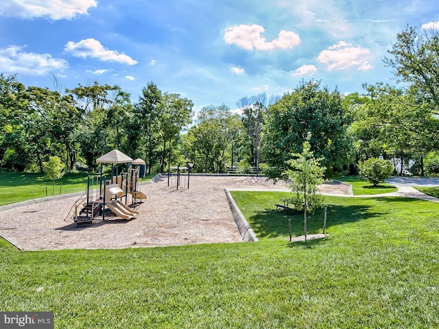 view of jungle gym featuring a lawn