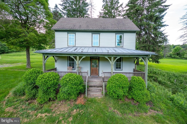 farmhouse-style home featuring a front yard and a porch