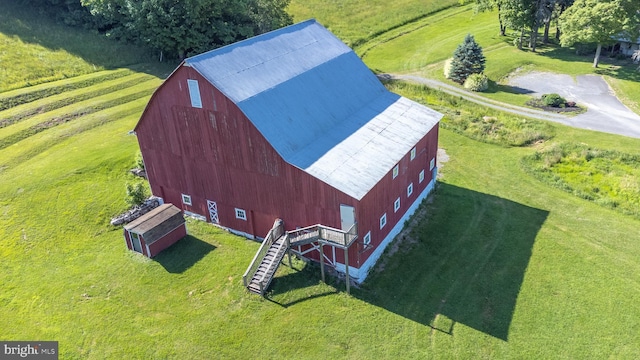 birds eye view of property with a rural view