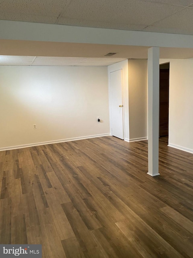 basement featuring dark hardwood / wood-style flooring