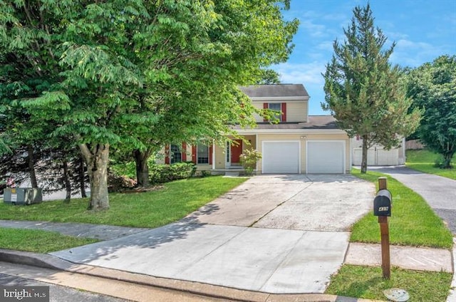 obstructed view of property featuring a front yard and a garage