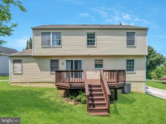 rear view of house featuring central AC, a lawn, and a wooden deck