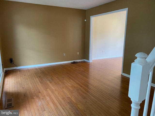 unfurnished room featuring light hardwood / wood-style floors