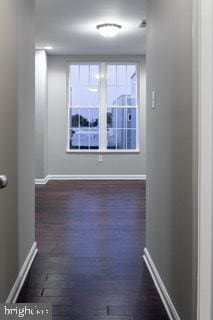 spare room featuring dark hardwood / wood-style flooring