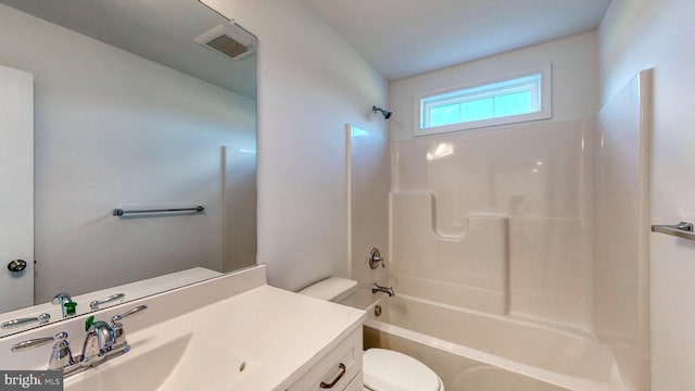 full bathroom featuring toilet, shower / washtub combination, and vanity