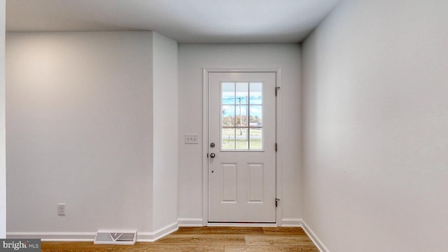 doorway with light hardwood / wood-style floors