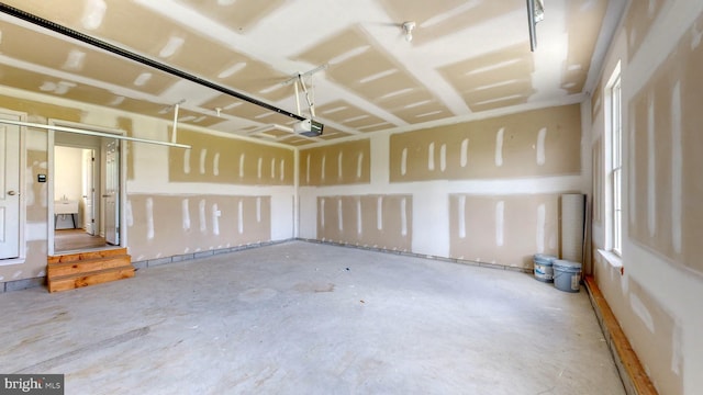 garage featuring sink and a garage door opener