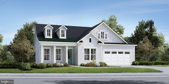 view of front of home featuring a front yard and a garage