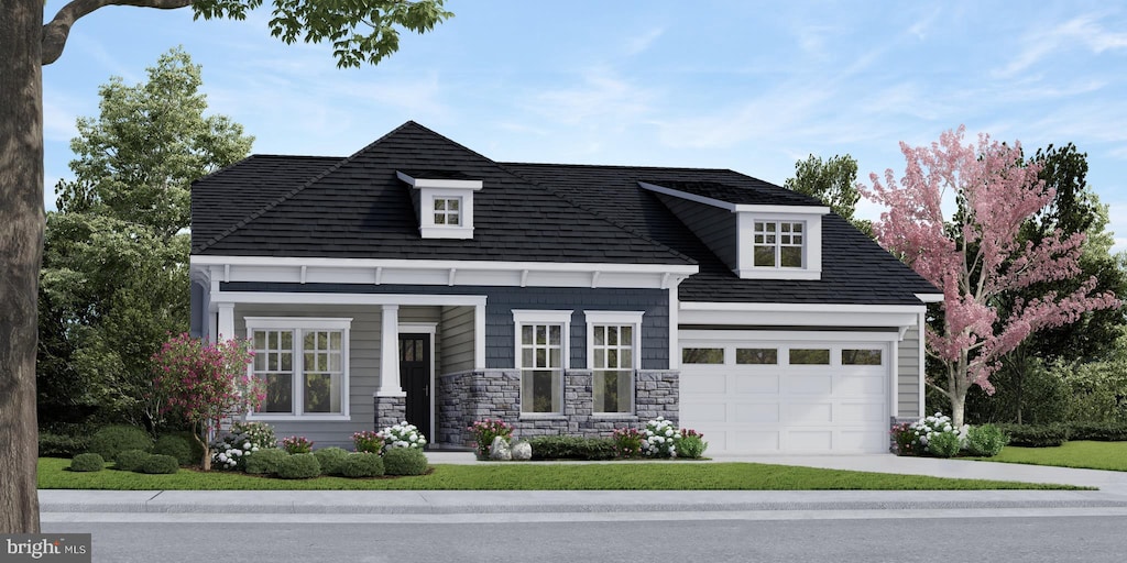 view of front of home with a porch and a garage