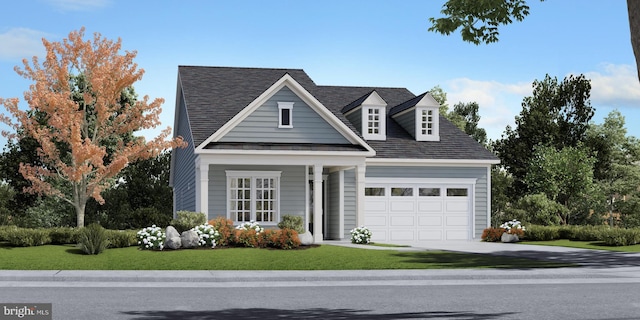 view of front of home featuring a front lawn and a garage