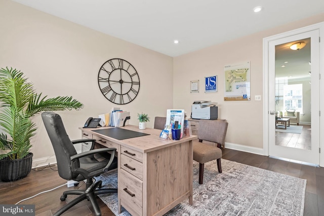 office space with dark hardwood / wood-style flooring