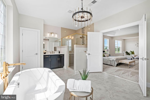 dining area with an inviting chandelier, sink, and light tile flooring