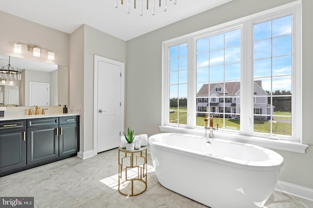 bathroom with a bath to relax in, tile flooring, and oversized vanity