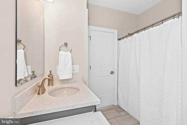 bathroom featuring tile flooring and vanity