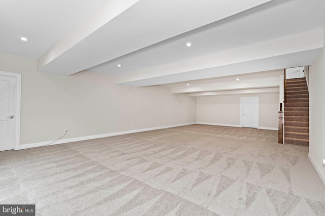 basement featuring light carpet