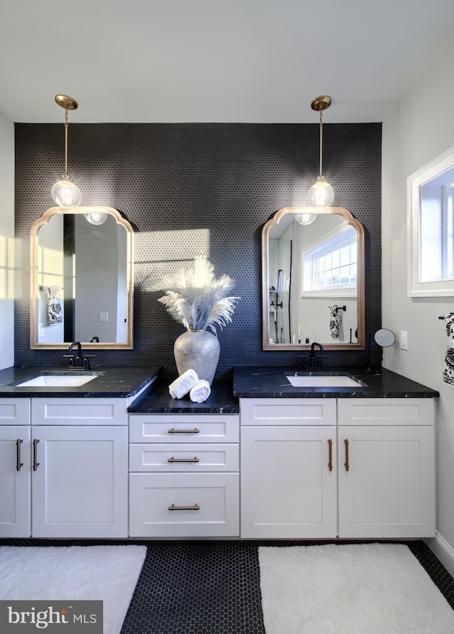 bathroom with vanity and a healthy amount of sunlight