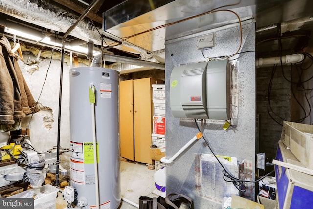 utility room featuring gas water heater