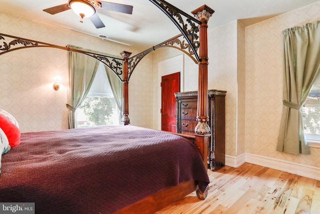 bedroom featuring light hardwood / wood-style floors and ceiling fan