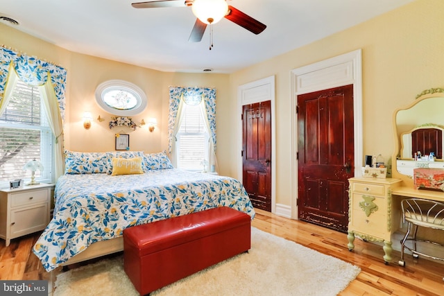 bedroom with ceiling fan and light wood-type flooring