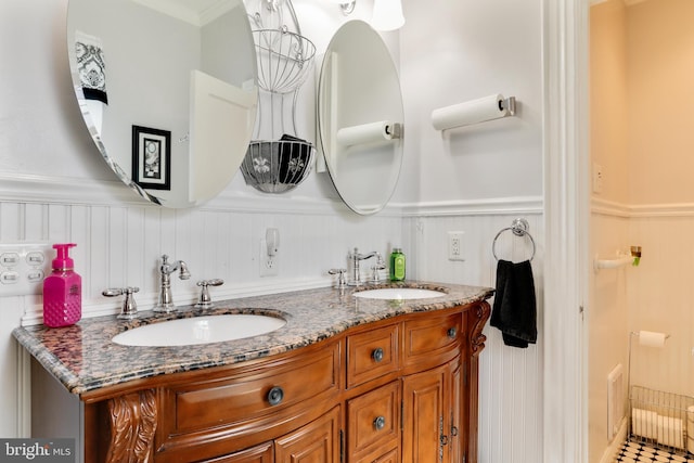 bathroom featuring dual bowl vanity, tile flooring, and ornamental molding