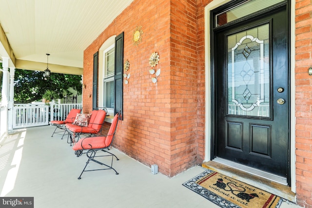 doorway to property featuring covered porch