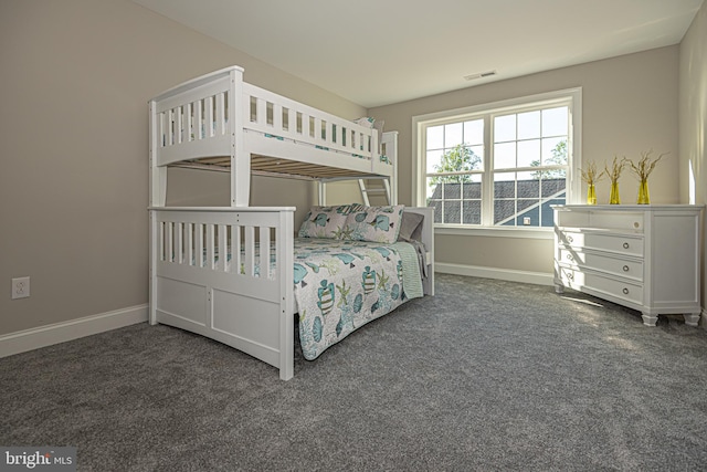 bedroom featuring dark colored carpet