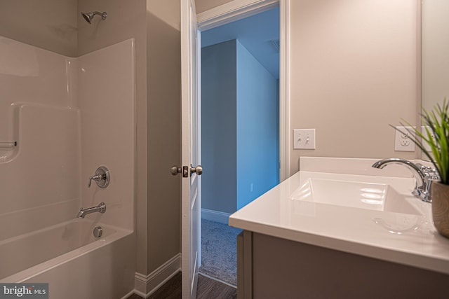 bathroom with vanity and shower / tub combination