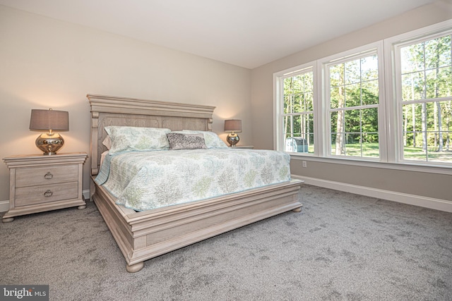 bedroom featuring light carpet