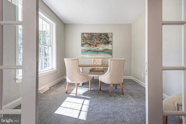 view of carpeted dining area