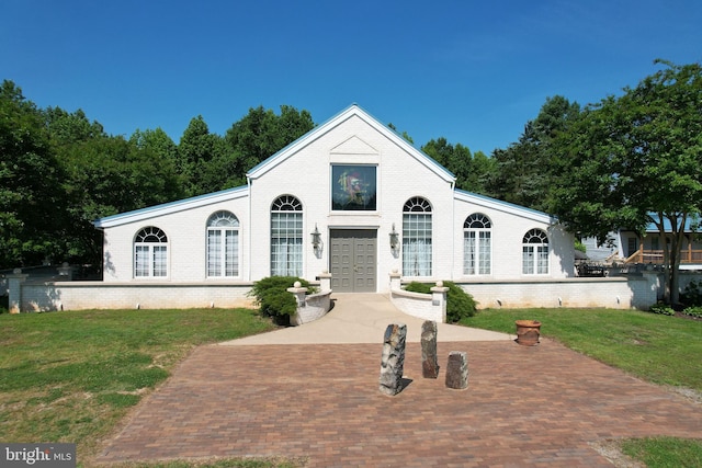 view of front of house featuring french doors and a front yard