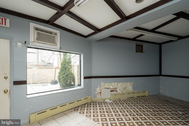 spare room featuring beamed ceiling, coffered ceiling, a wall mounted AC, and baseboard heating