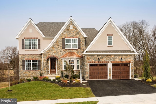 view of front of property with a garage and a front yard