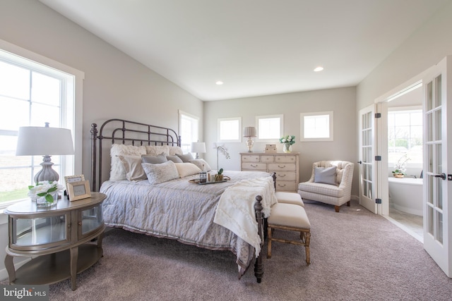 bedroom with french doors, carpet floors, and multiple windows