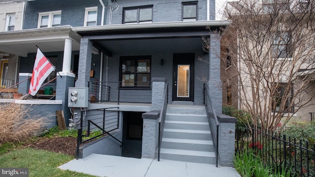 property entrance with covered porch