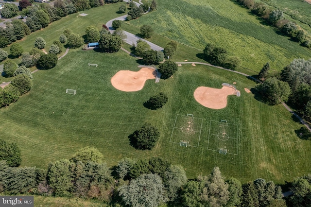 birds eye view of property with a rural view