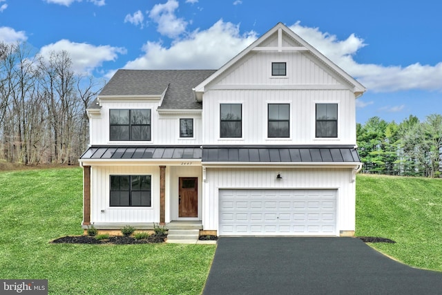 modern farmhouse style home with a front yard and a garage