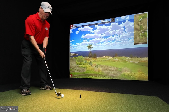 game room with golf simulator