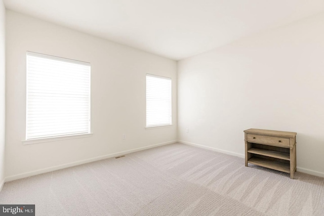 unfurnished room featuring carpet flooring