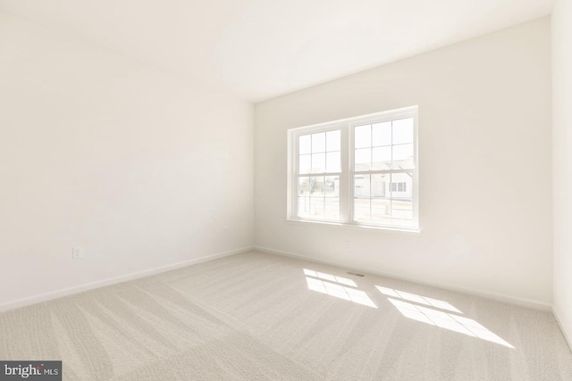 unfurnished room featuring carpet flooring