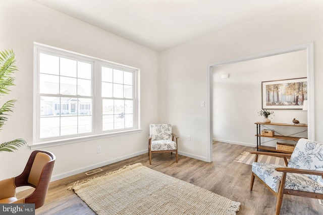 living area with wood-type flooring